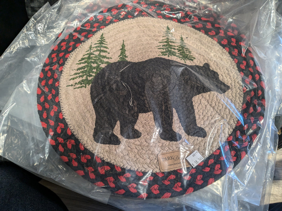 Braided Bear Placemats – Rustic and charming, these braided placemats feature an adorable bear design, perfect for adding a cozy touch to your dining table. Ideal for cabin decor or farmhouse-style settings, these durable, easy-to-clean placemats protect surfaces while enhancing your table's aesthetic. Perfect for everyday use or special occasions, they make a great gift for nature lovers and home decor enthusiasts.